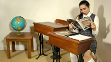 Adriana Evans reading spanking magazines